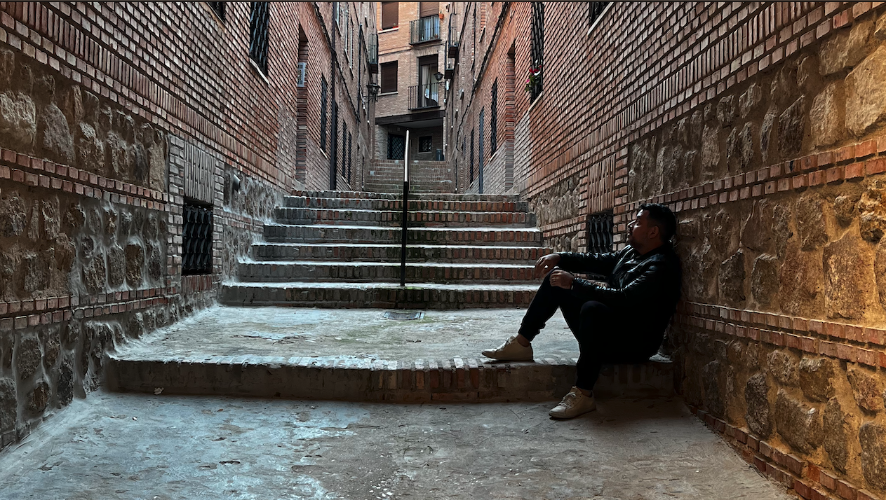 Jesus Gonzalez sit in a step looking to a wall in Toledo Spain